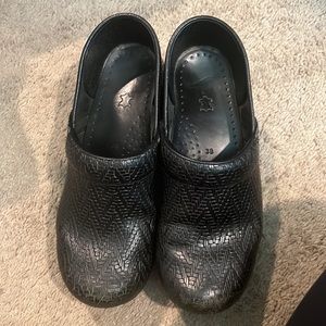 Dansko clogs, black, like new, slightly worn, size 38 women’s.